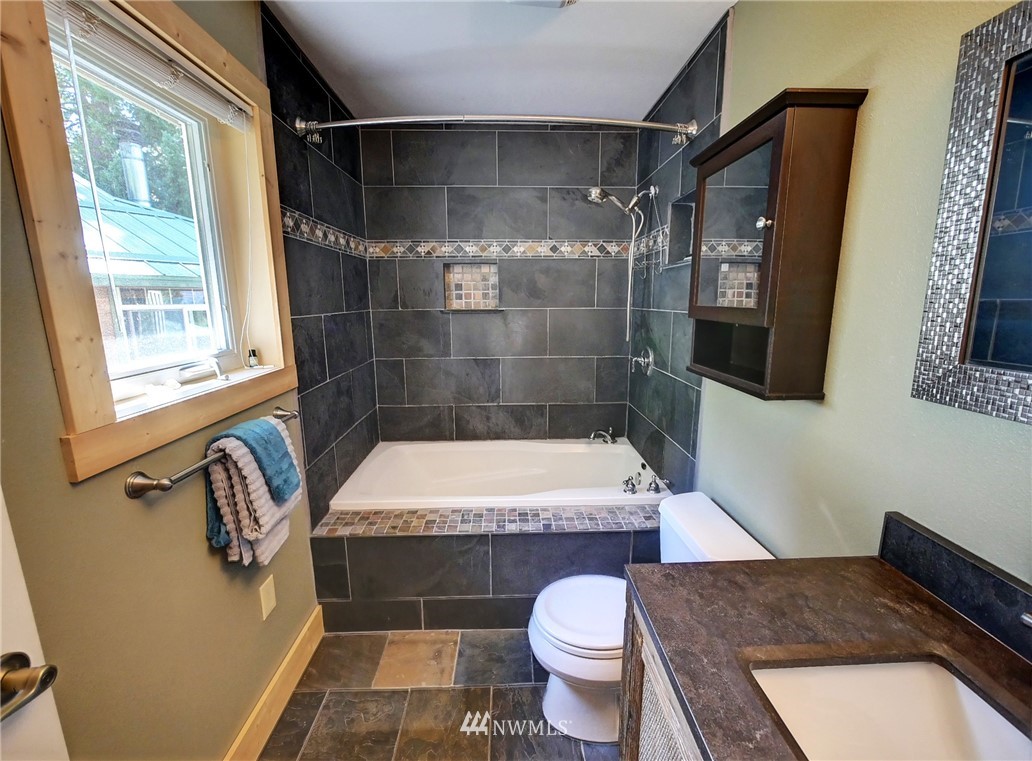 41 Trillium Road Winthrop, WA 98862 - Photo 25 of 39 a bathroom with a sink toilet and shower