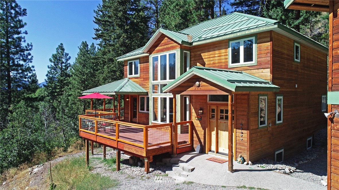 41 Trillium Road Winthrop, WA 98862 - Photo 7 of 39 a front view of a house with a yard and deck