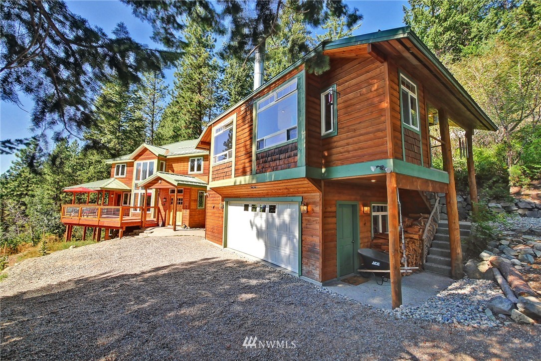 41 Trillium Road Winthrop, WA 98862 - Photo 9 of 39 a view of a house with a yard and wooden fence