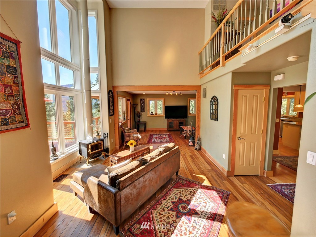 41 Trillium Road Winthrop, WA 98862 - Photo 10 of 39 a living room with furniture gym equipment and a large window