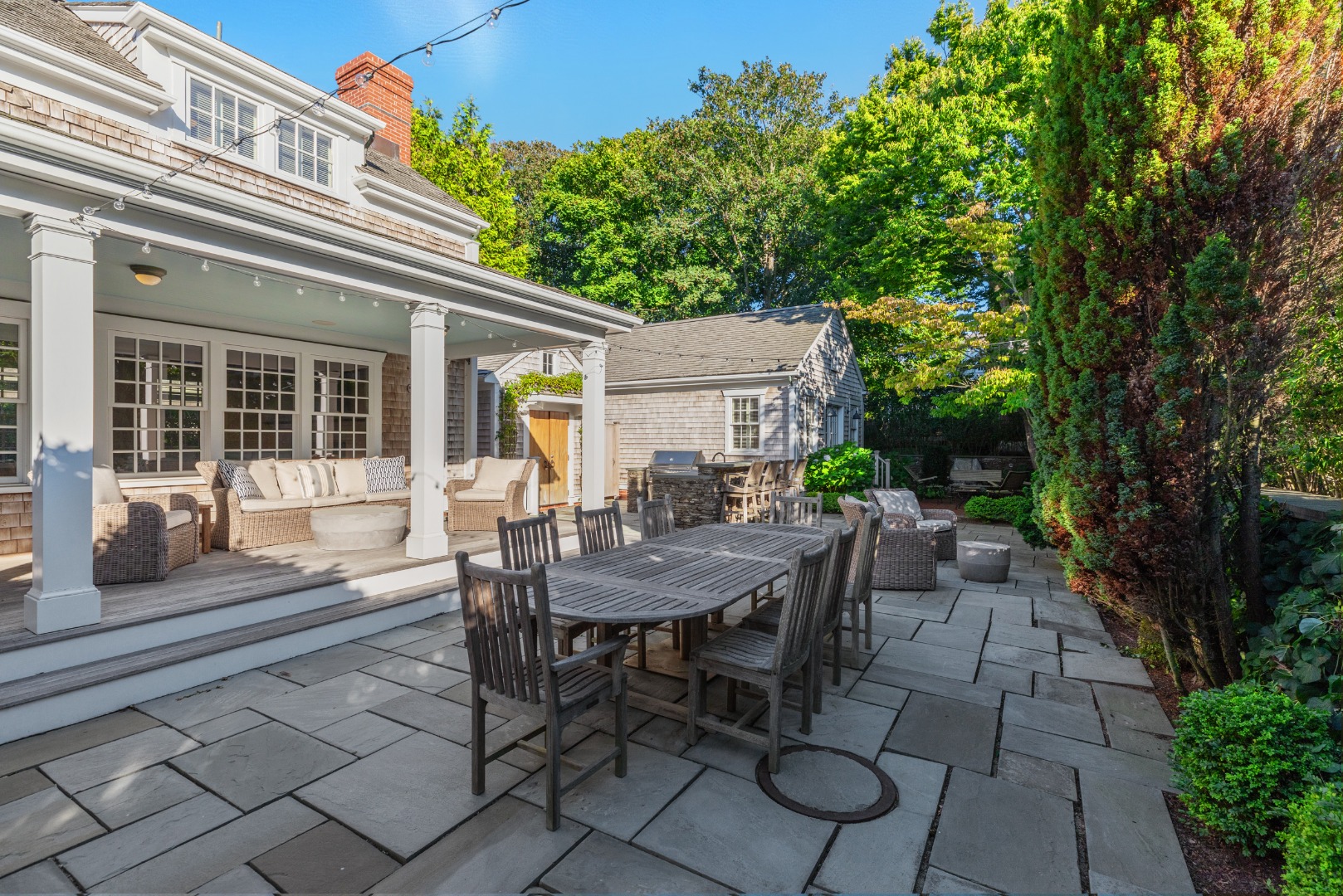 18 Mill Street Nantucket, MA 02554 - Photo 35 of 47 a view of a patio with table and chairs and potted plants
