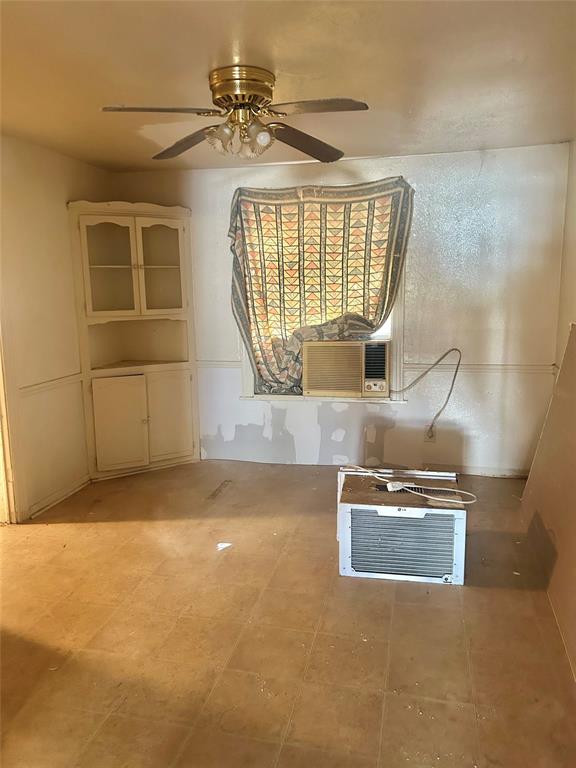 1016 North Howeth Street Gainesville, TX 76240 - Photo 3 of 15 a view of an empty room with a window