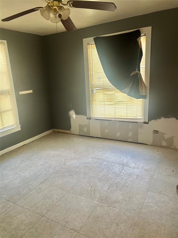 1016 North Howeth Street Gainesville, TX 76240 - Photo 9 of 15 an empty room with a window