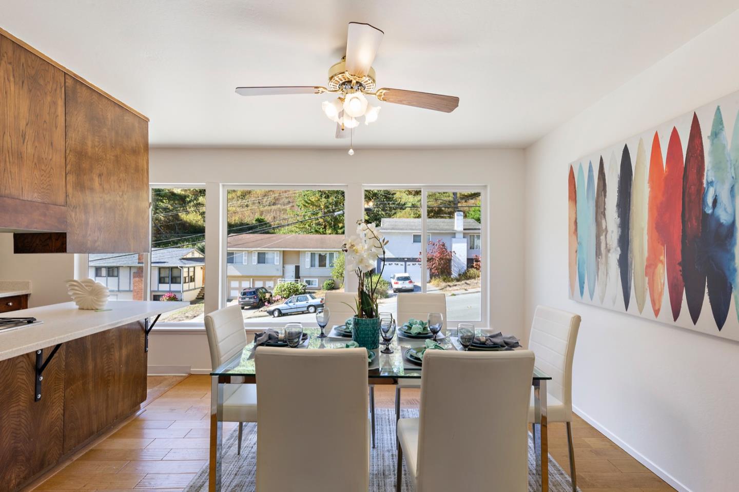1528 Terra Nova Boulevard Pacifica, CA 94044 - Photo 11 of 32 a room with furniture a large window and a chandelier