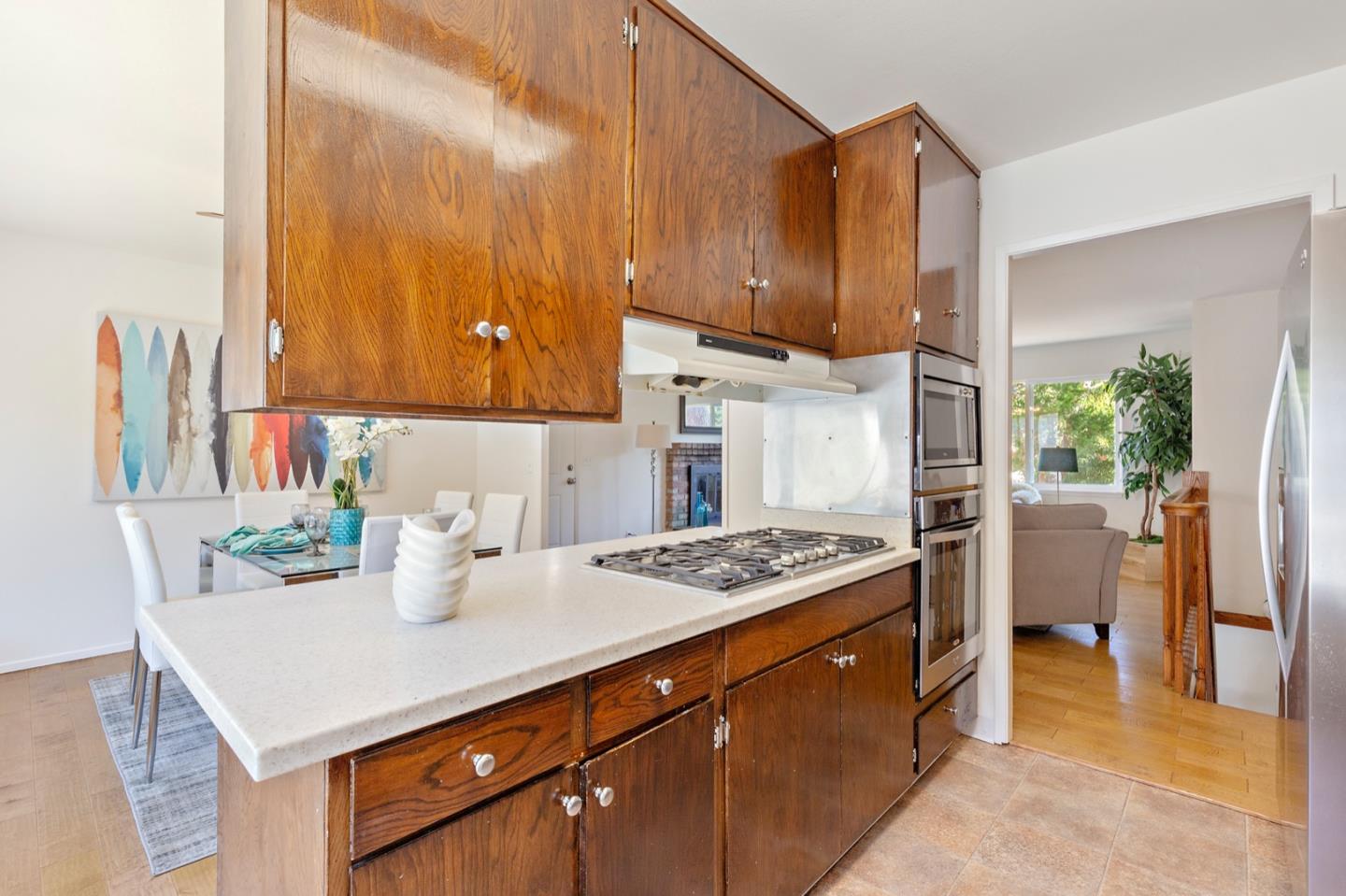 1528 Terra Nova Boulevard Pacifica, CA 94044 - Photo 14 of 32 a kitchen with a stove a sink and a cabinets