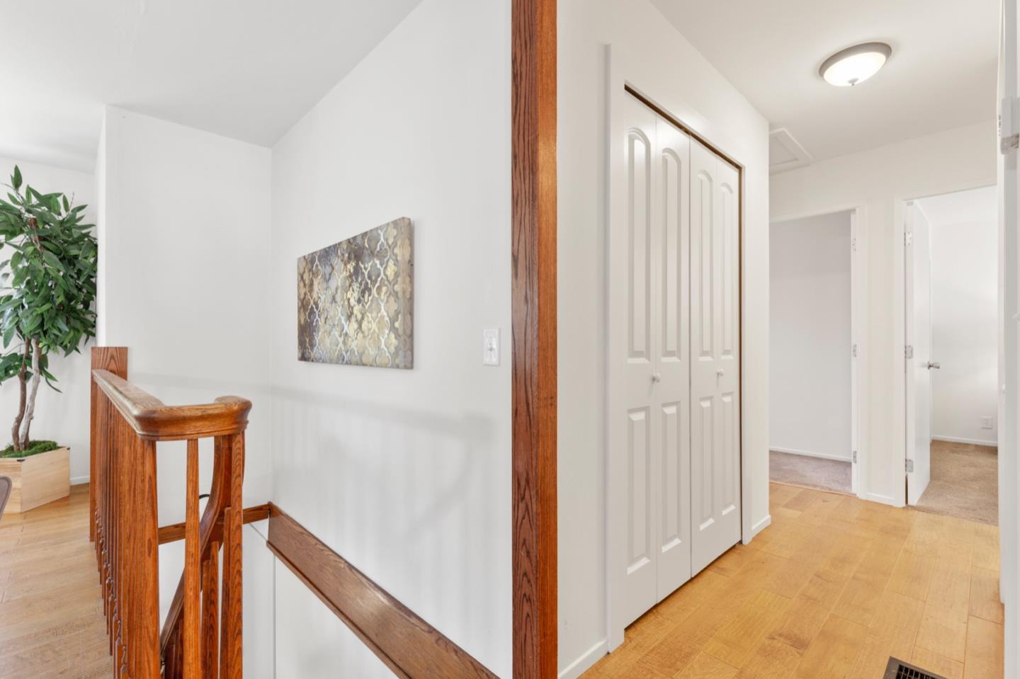 1528 Terra Nova Boulevard Pacifica, CA 94044 - Photo 16 of 32 a view of a hallway with paintings on the wall