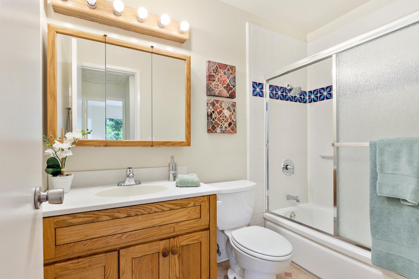 1528 Terra Nova Boulevard Pacifica, CA 94044 - Photo 17 of 32 a bathroom with a sink a toilet and shower