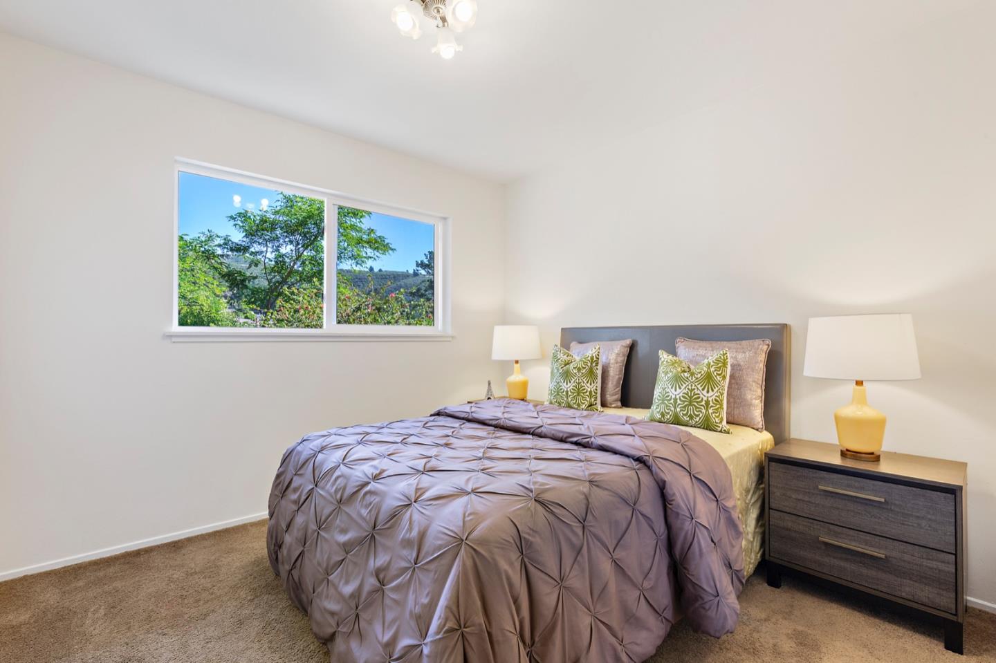 1528 Terra Nova Boulevard Pacifica, CA 94044 - Photo 18 of 32 a bedroom with a bed and a window