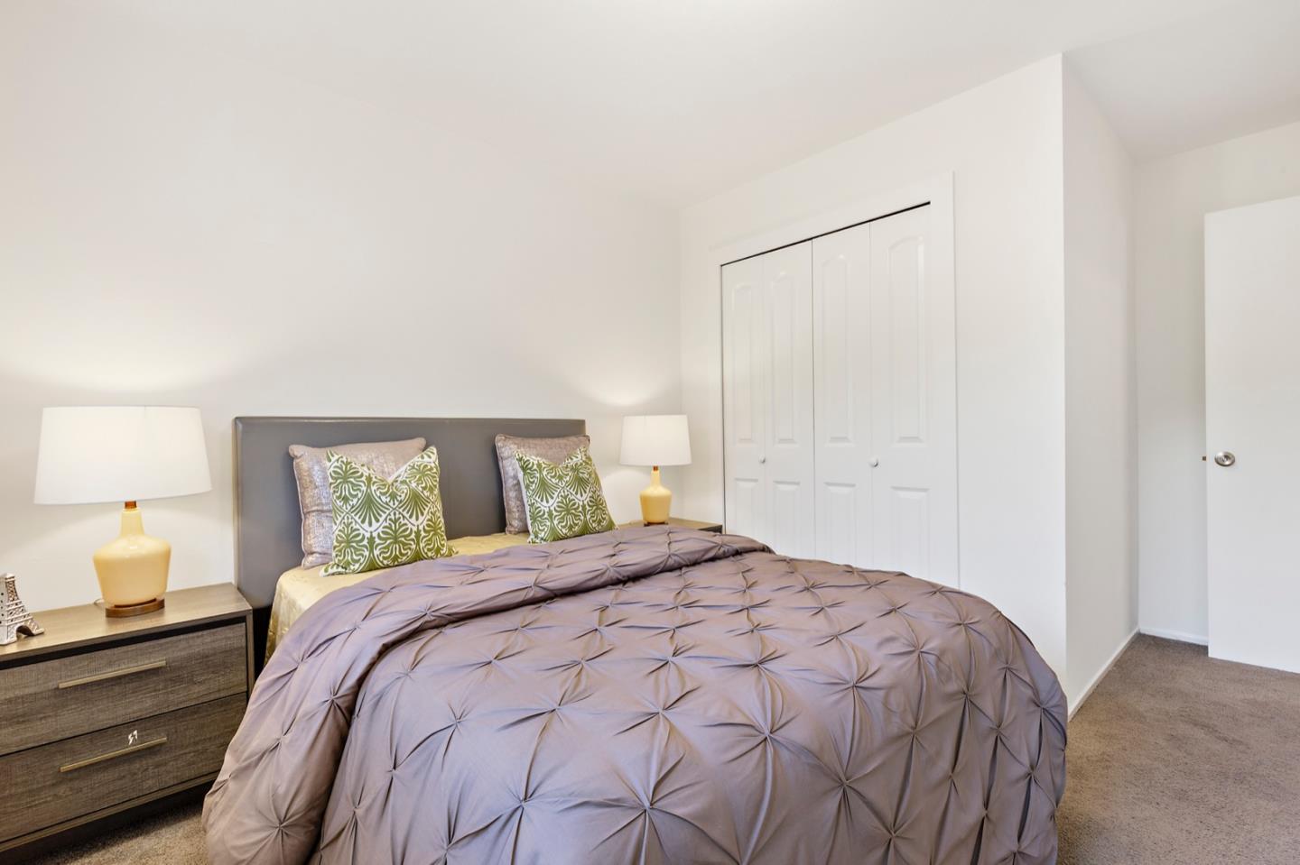 1528 Terra Nova Boulevard Pacifica, CA 94044 - Photo 19 of 32 a bedroom with a bed and a window