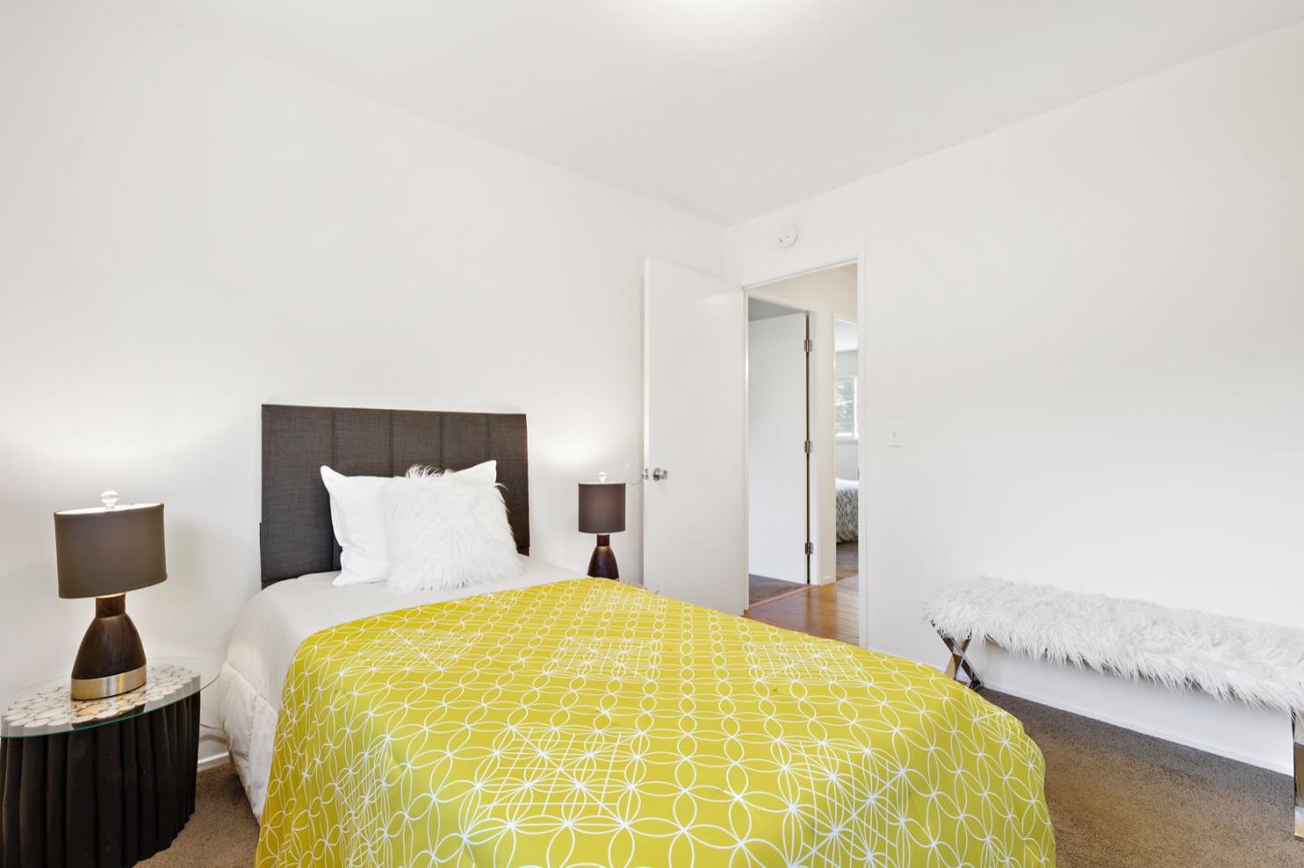 1528 Terra Nova Boulevard Pacifica, CA 94044 - Photo 21 of 32 a bedroom with a bed and a lamp