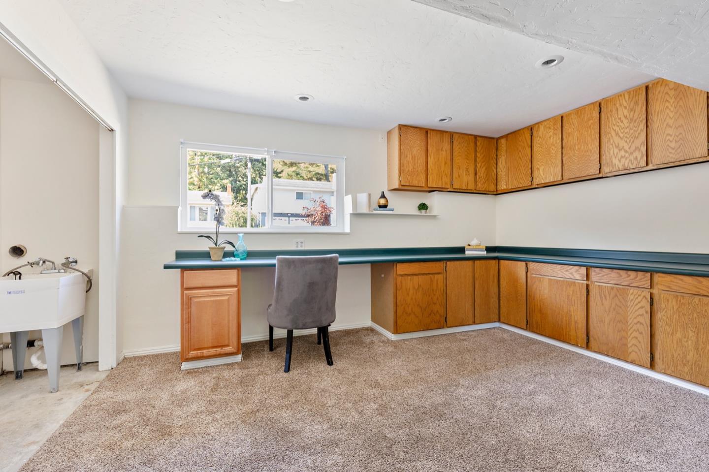 1528 Terra Nova Boulevard Pacifica, CA 94044 - Photo 28 of 32 a kitchen with a sink cabinets and a window