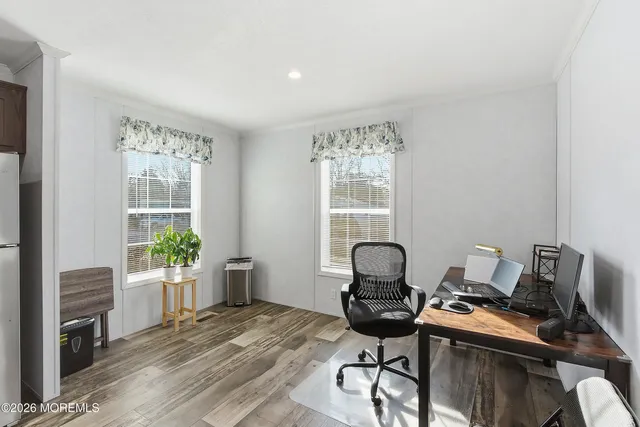 a workspace with furniture and a window