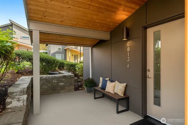 a balcony with furniture and a potted plant