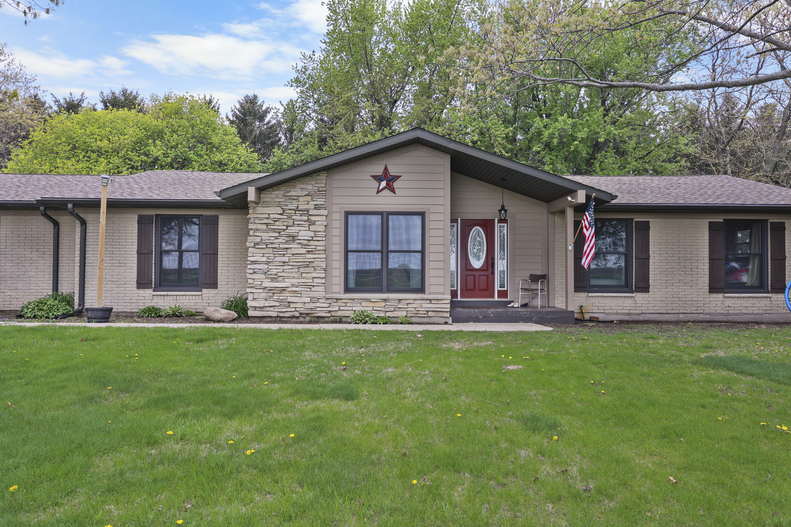 15547 Tower Road Lee, IL 60530 - Photo 1 of 24 a front view of house with yard and outdoor seating