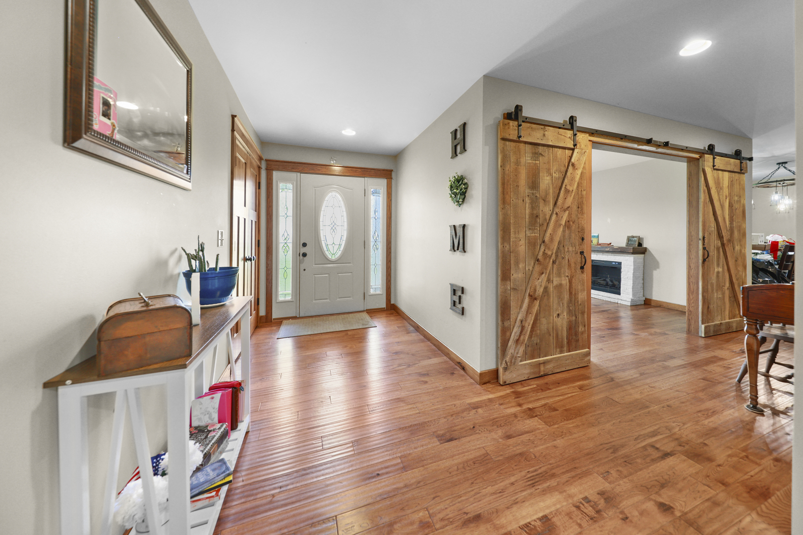 15547 Tower Road Lee, IL 60530 - Photo 3 of 24 a hallway with wooden floor and furniture