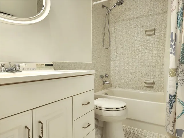 a bathroom with a sink a toilet and a bathtub