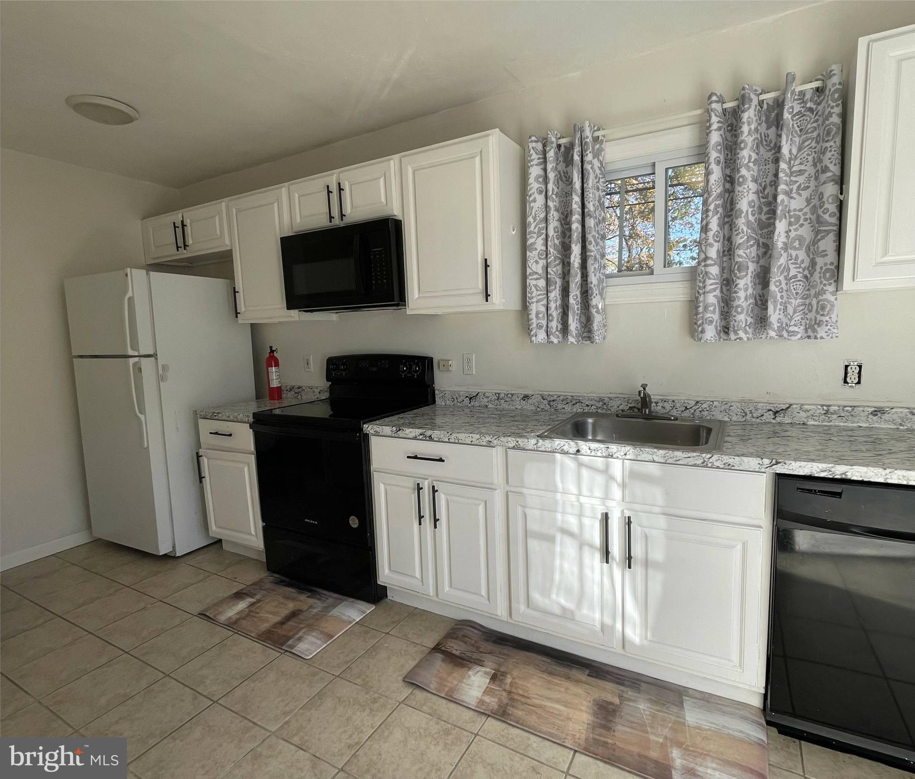 1902 Spencer Drive Croydon, PA 19021 - Photo 16 of 61 a kitchen with a refrigerator stove and sink