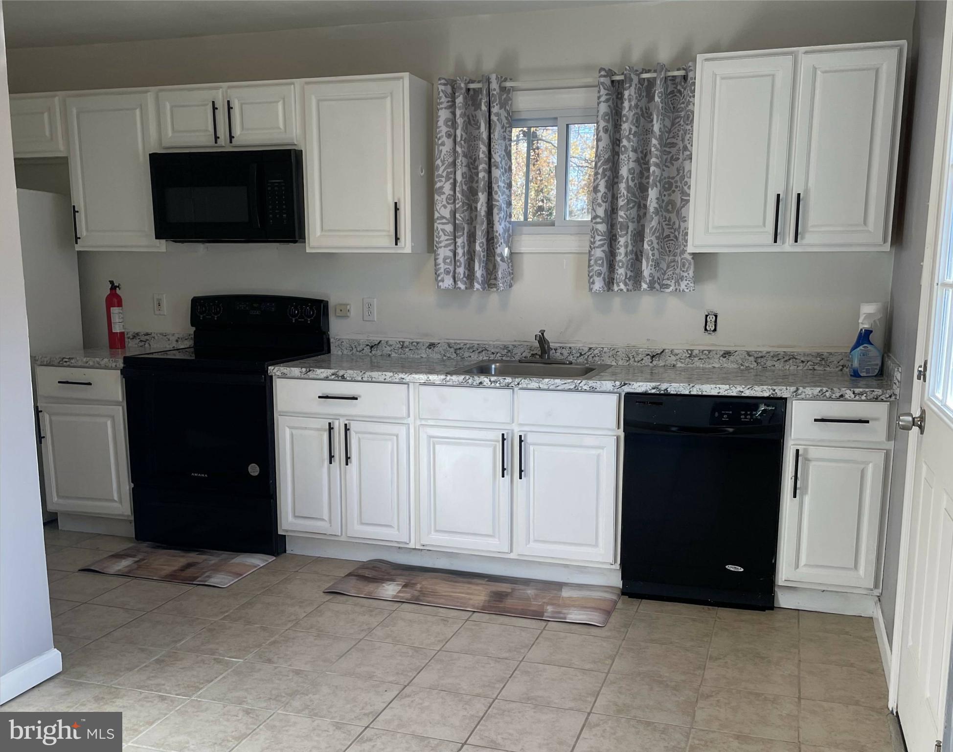 1902 Spencer Drive Croydon, PA 19021 - Photo 17 of 61 a kitchen with a sink and a stove top oven