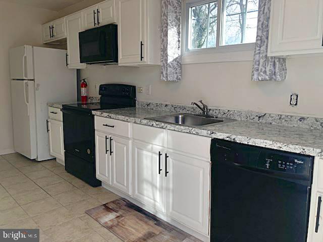 1902 Spencer Drive Croydon, PA 19021 - Photo 19 of 61 a kitchen with stainless steel appliances granite countertop a sink stove and microwave