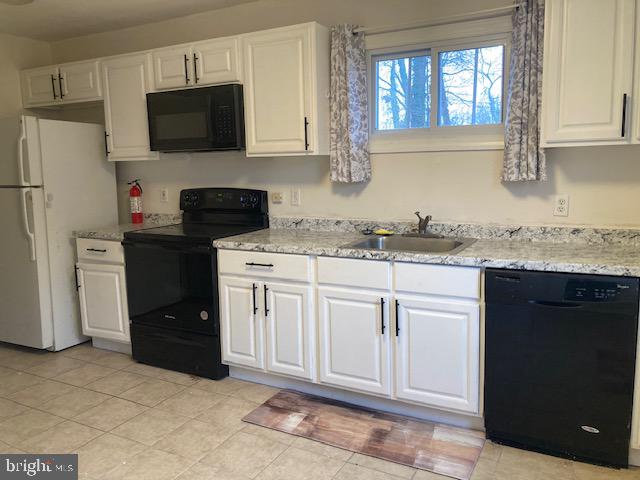 1902 Spencer Drive Croydon, PA 19021 - Photo 33 of 61 a kitchen with a sink stove and refrigerator