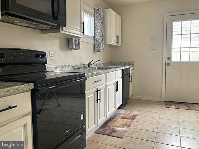 1902 Spencer Drive Croydon, PA 19021 - Photo 36 of 61 a kitchen with stainless steel appliances granite countertop a stove and a sink