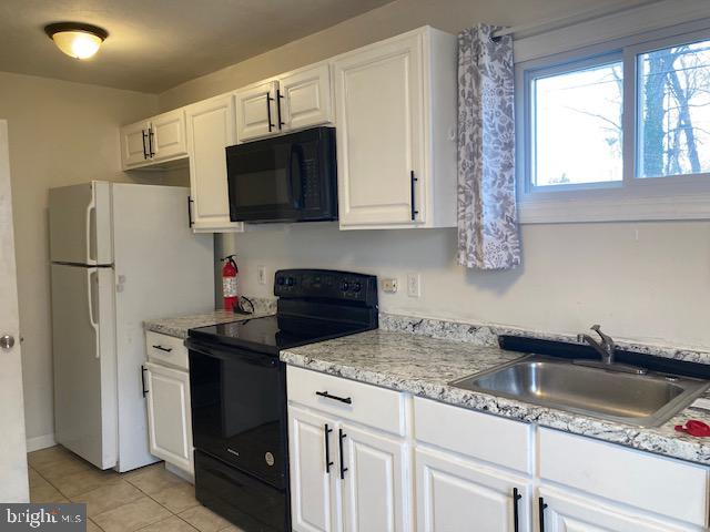 1902 Spencer Drive Croydon, PA 19021 - Photo 50 of 61 a kitchen with granite countertop a sink stainless steel appliances and cabinets