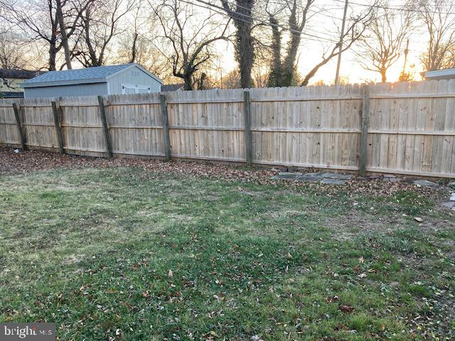 1902 Spencer Drive Croydon, PA 19021 - Photo 6 of 61 a view of a backyard with a large tree and wooden fence