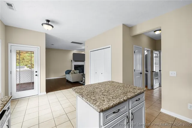 a room that has a sink and a table in it