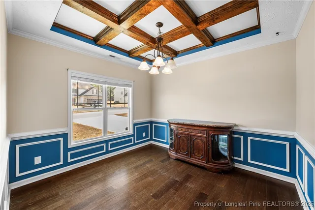 a room with wooden floors and pool table