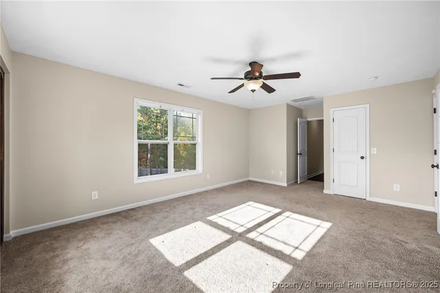 a view of workspace with window and a ceiling fan