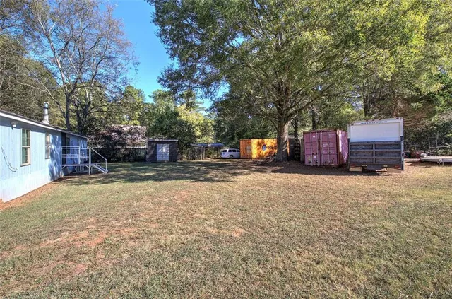 a view of a yard with a tree