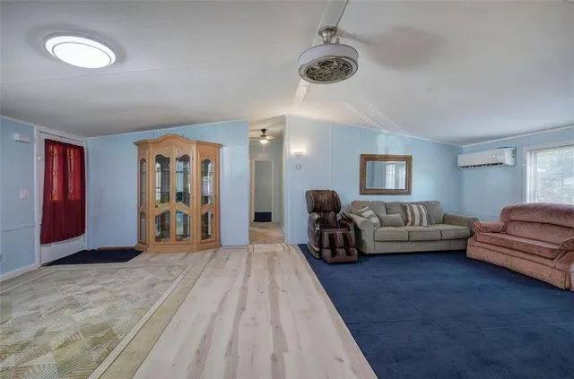 a spacious bedroom with a bed and a couch