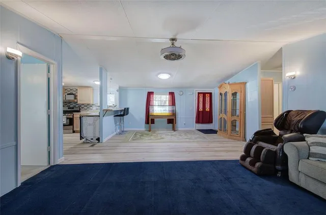 a view of a livingroom with furniture and wooden floor