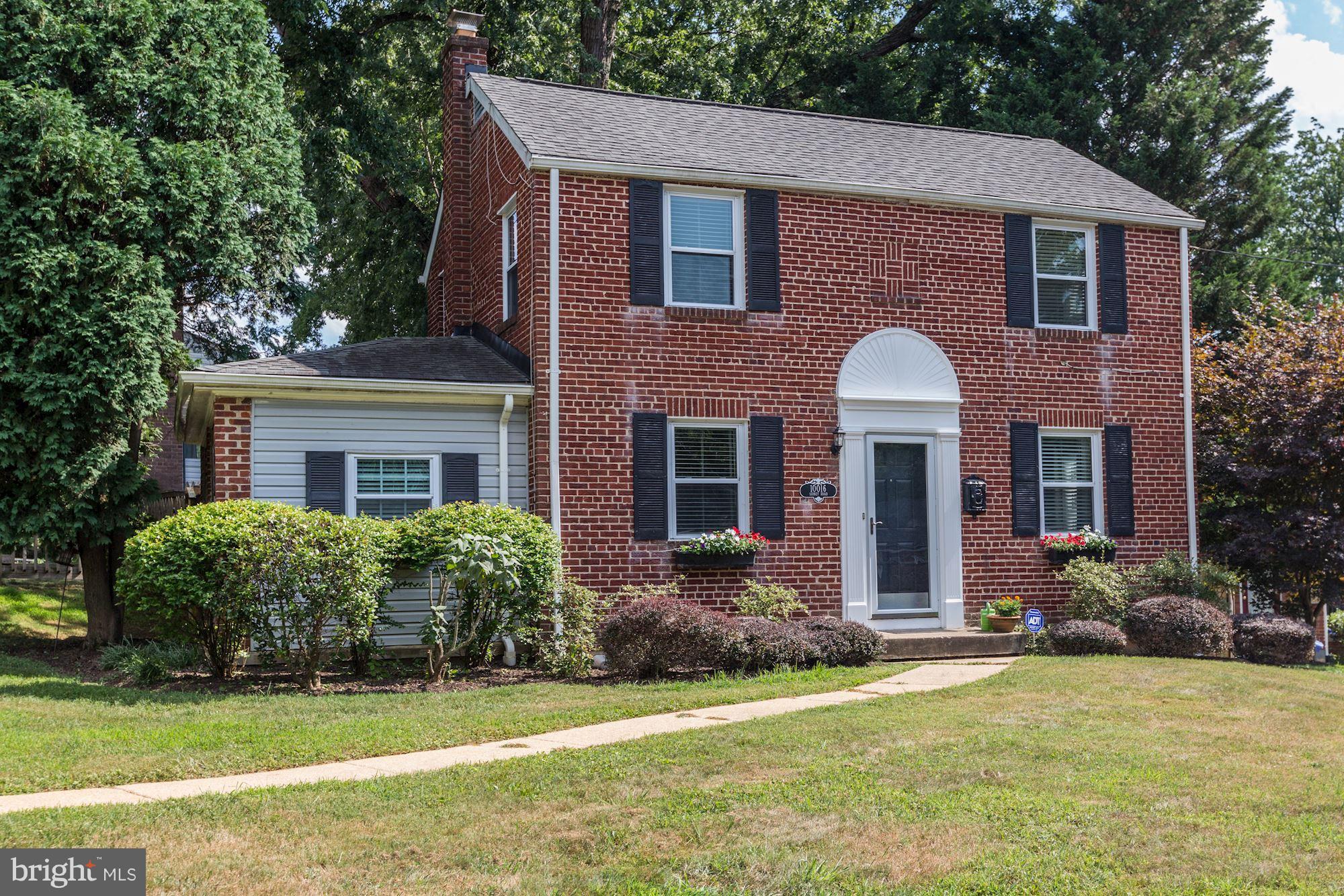 10016 Sidney Road Silver Spring, MD 20901 - Photo 1 of 25 a front view of a house with a garden