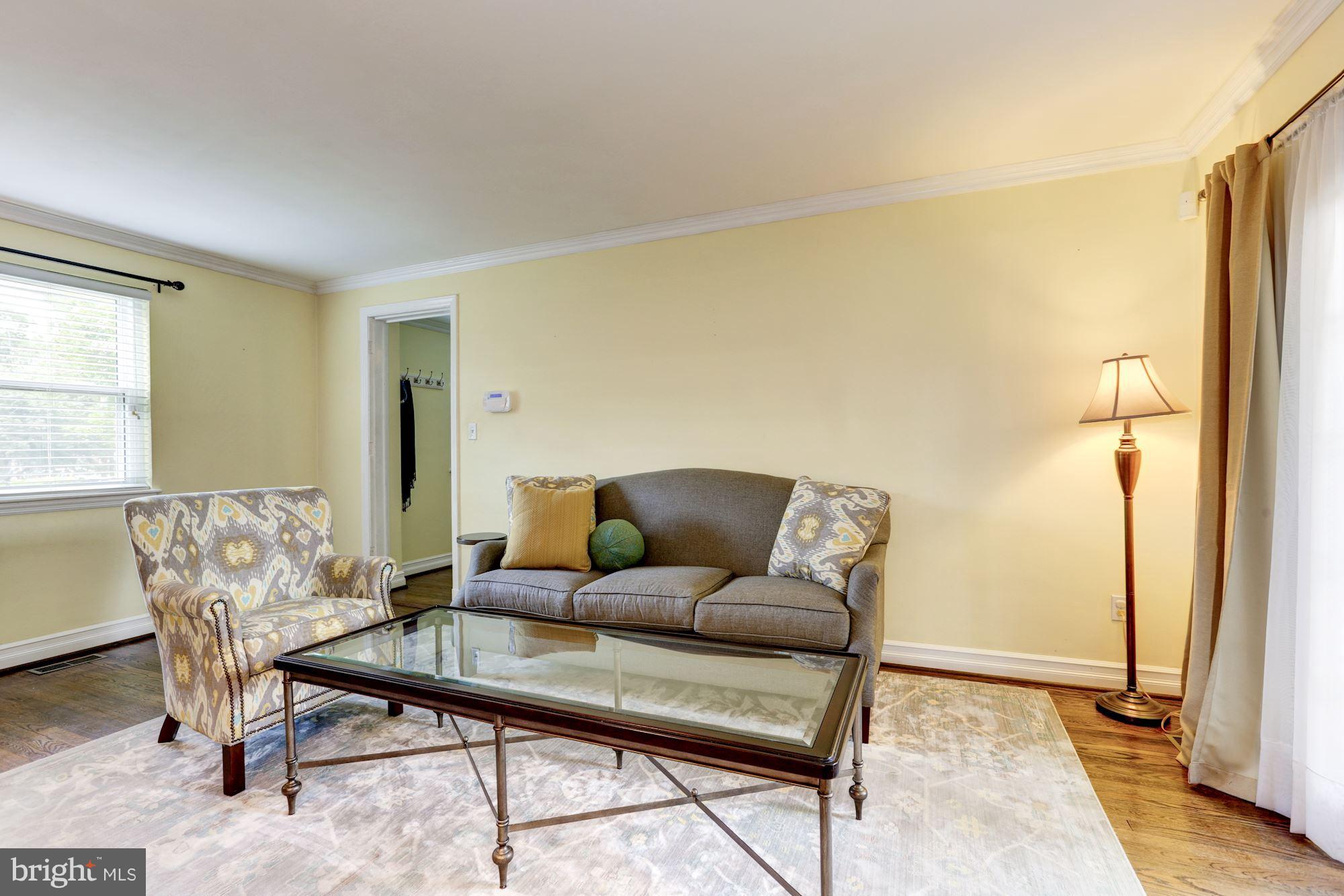 10016 Sidney Road Silver Spring, MD 20901 - Photo 17 of 25 a living room with furniture and a window