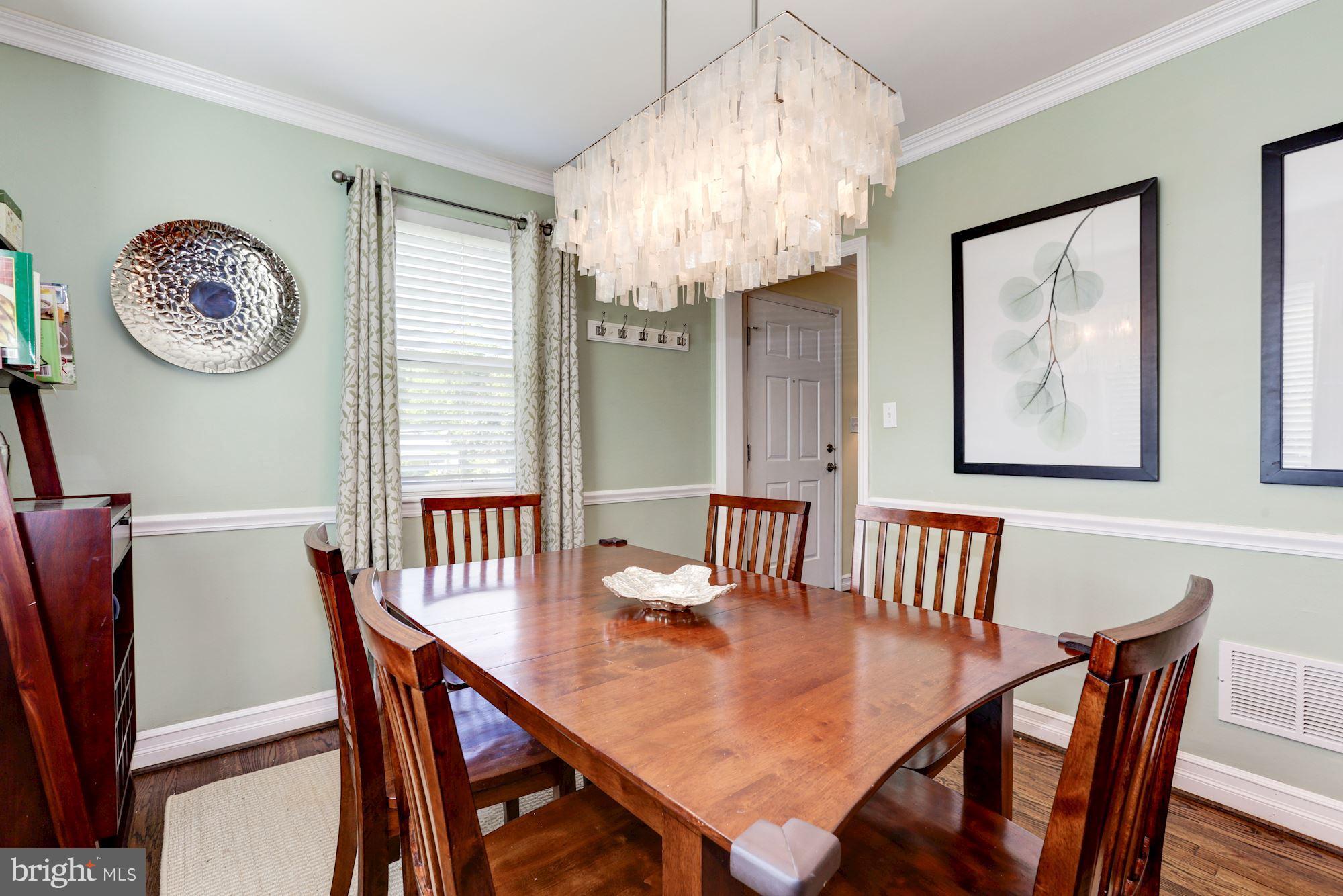 10016 Sidney Road Silver Spring, MD 20901 - Photo 8 of 25 a view of a dining room with furniture window and wooden floor