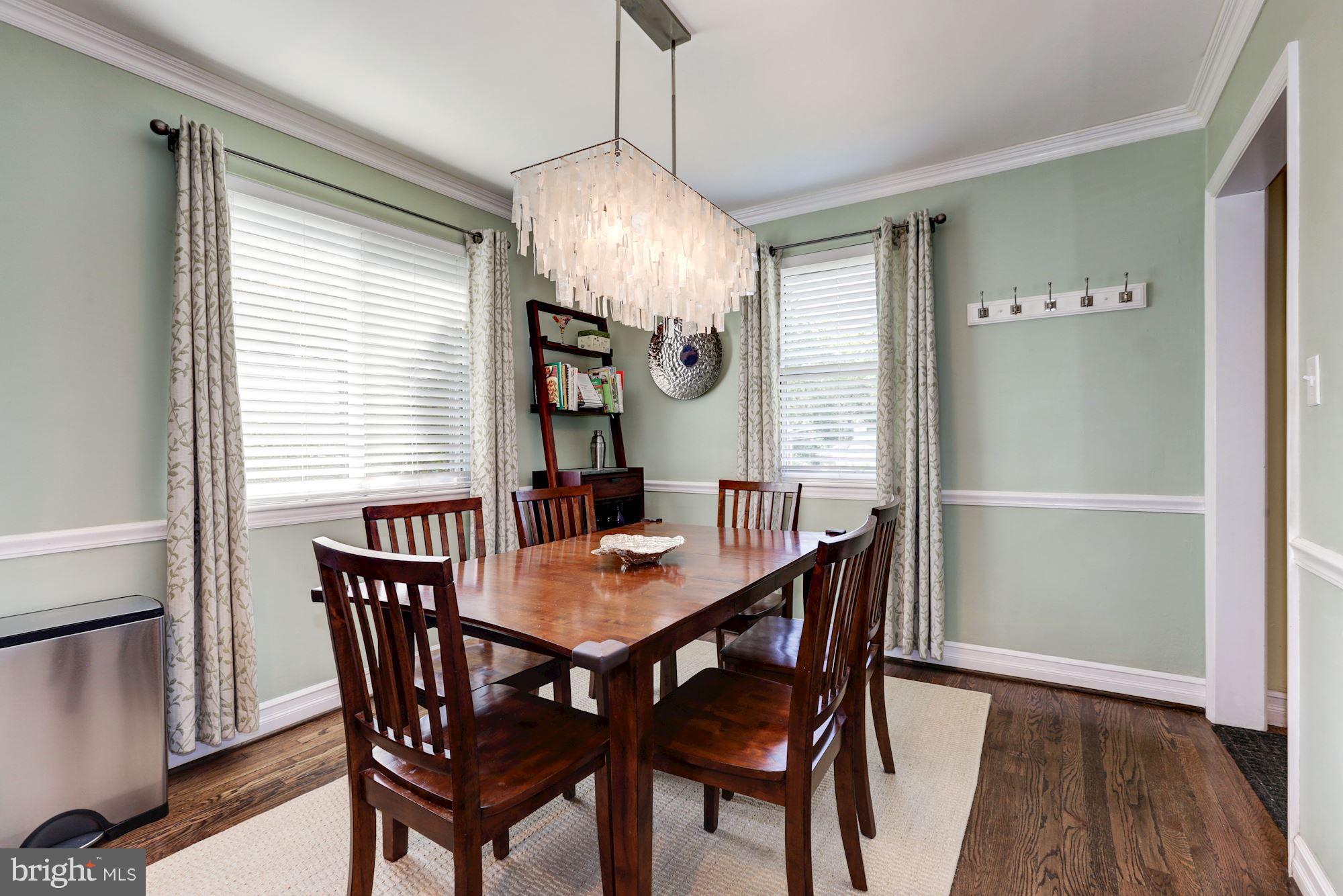 10016 Sidney Road Silver Spring, MD 20901 - Photo 9 of 25 a view of a dining room with furniture window and wooden floor