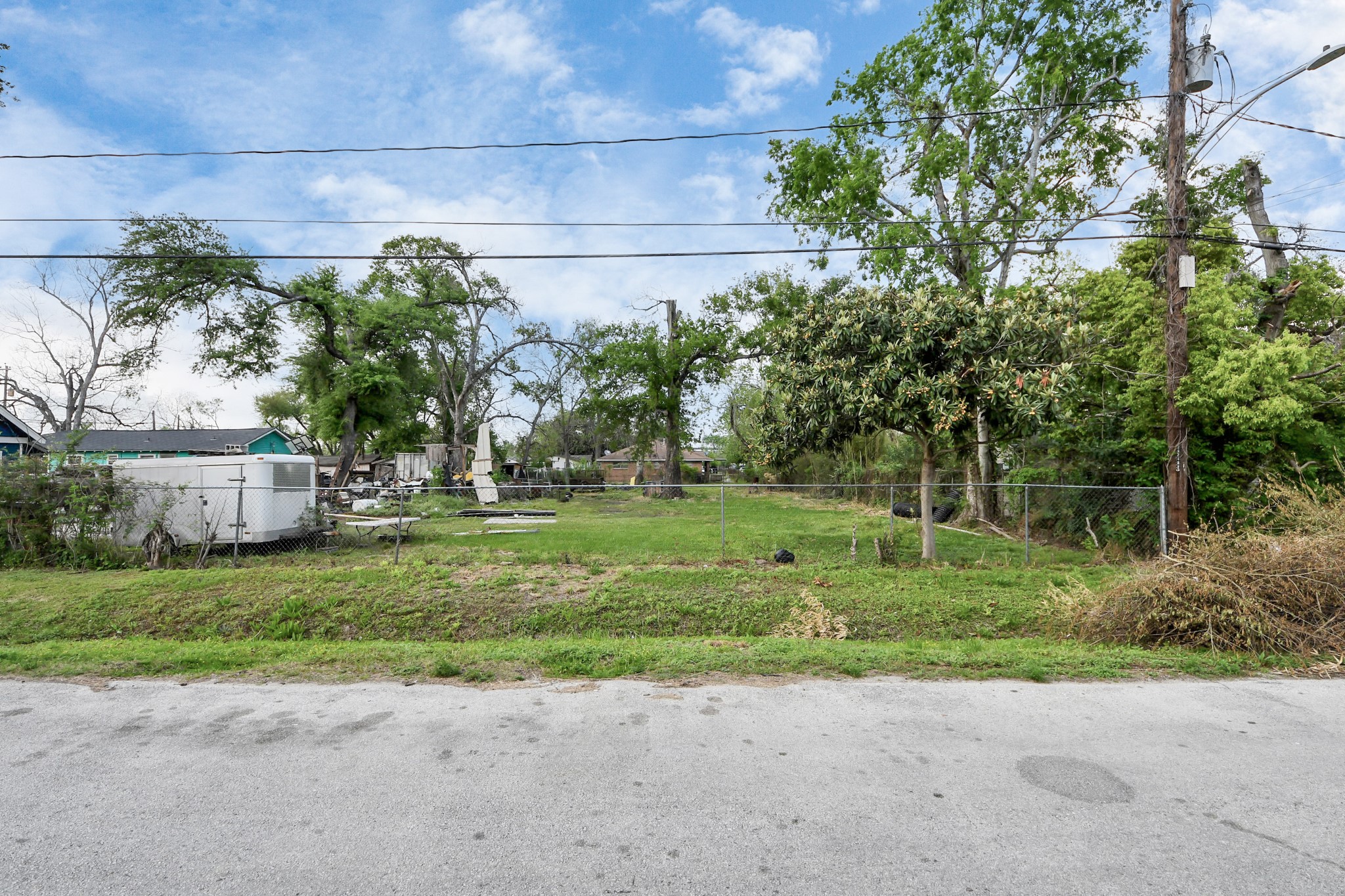 0 Memel Street Houston, TX 77026 - Photo 10 of 11 a backyard of a house with plants and large trees