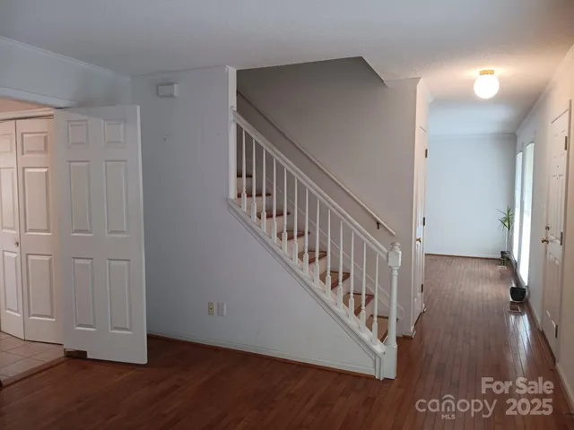 a view of an entryway with wooden floor