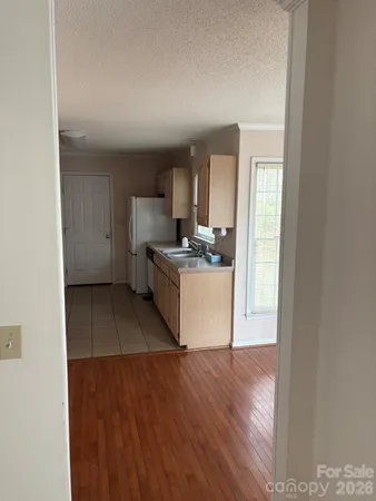 a kitchen with a stove a refrigerator and a sink