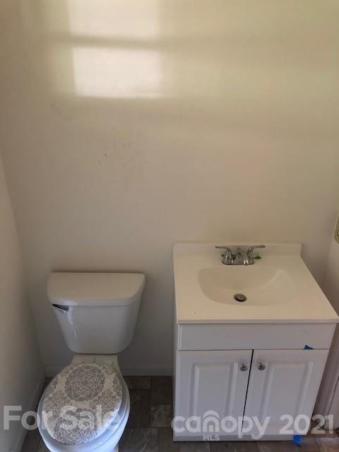 302 Lydia Street Monroe, NC 28110 - Photo 13 of 14 a bathroom with a sink and a toilet