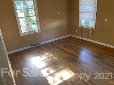 302 Lydia Street Monroe, NC 28110 - Photo 8 of 14 a view of empty room with wooden floor and fan
