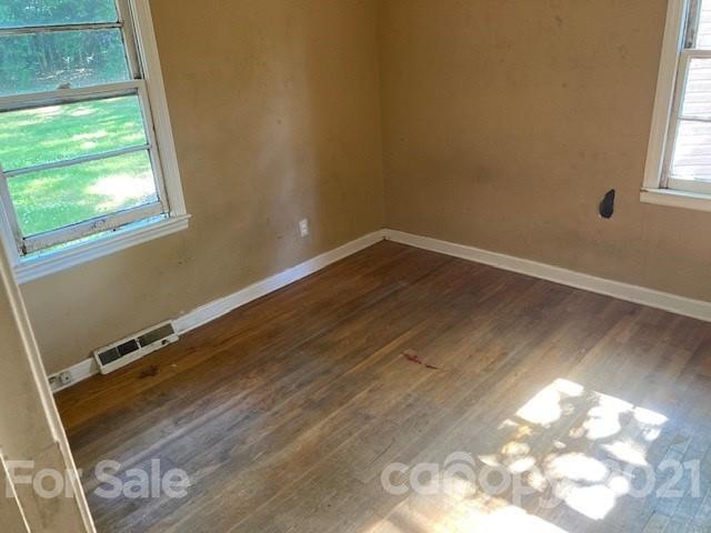 302 Lydia Street Monroe, NC 28110 - Photo 9 of 14 a view of a room with wooden floor and windows