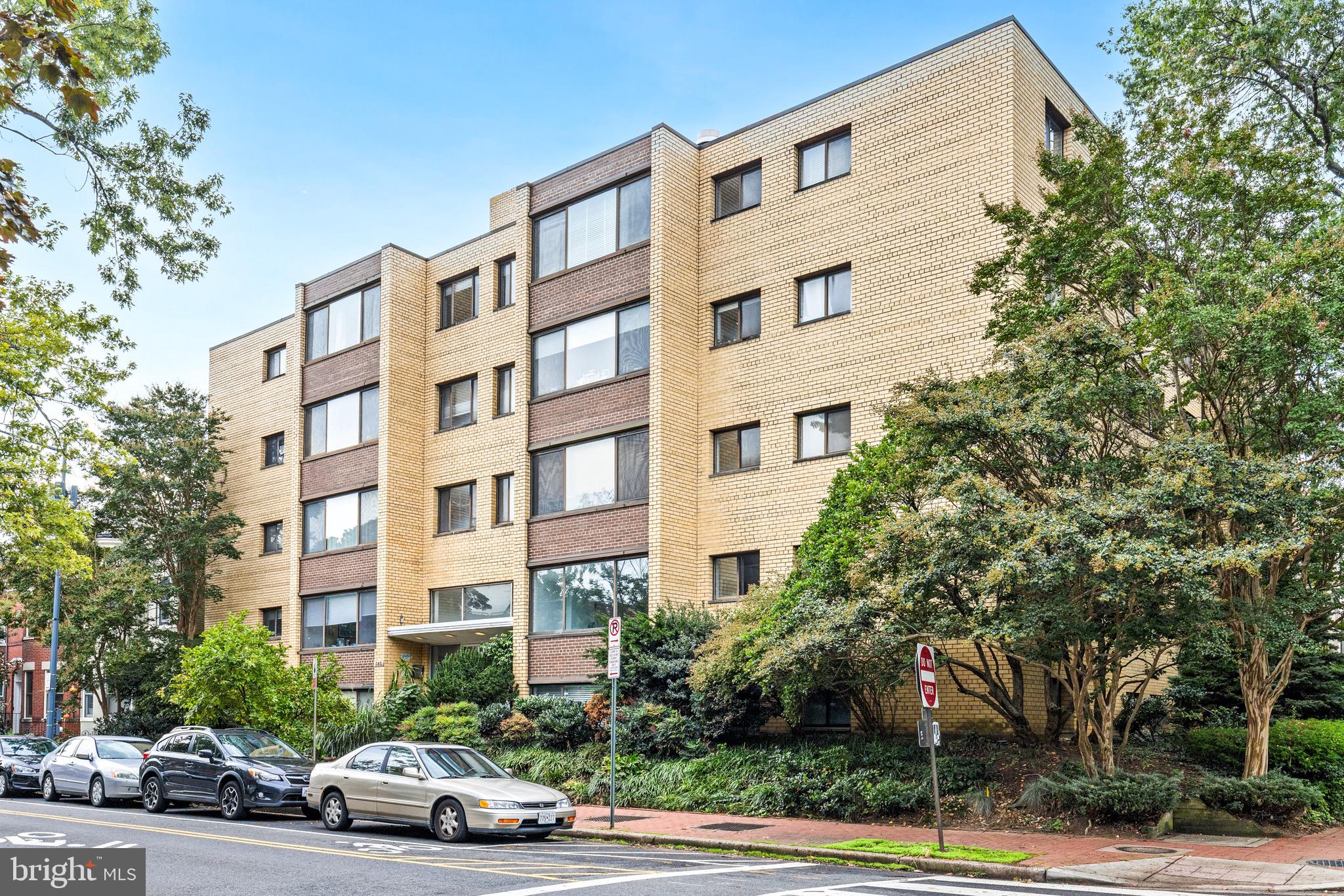 305 C Street Northeast, Unit 410 Washington, DC 20002 - Photo 2 of 15 a car parked in front of a building and a cars parked on road