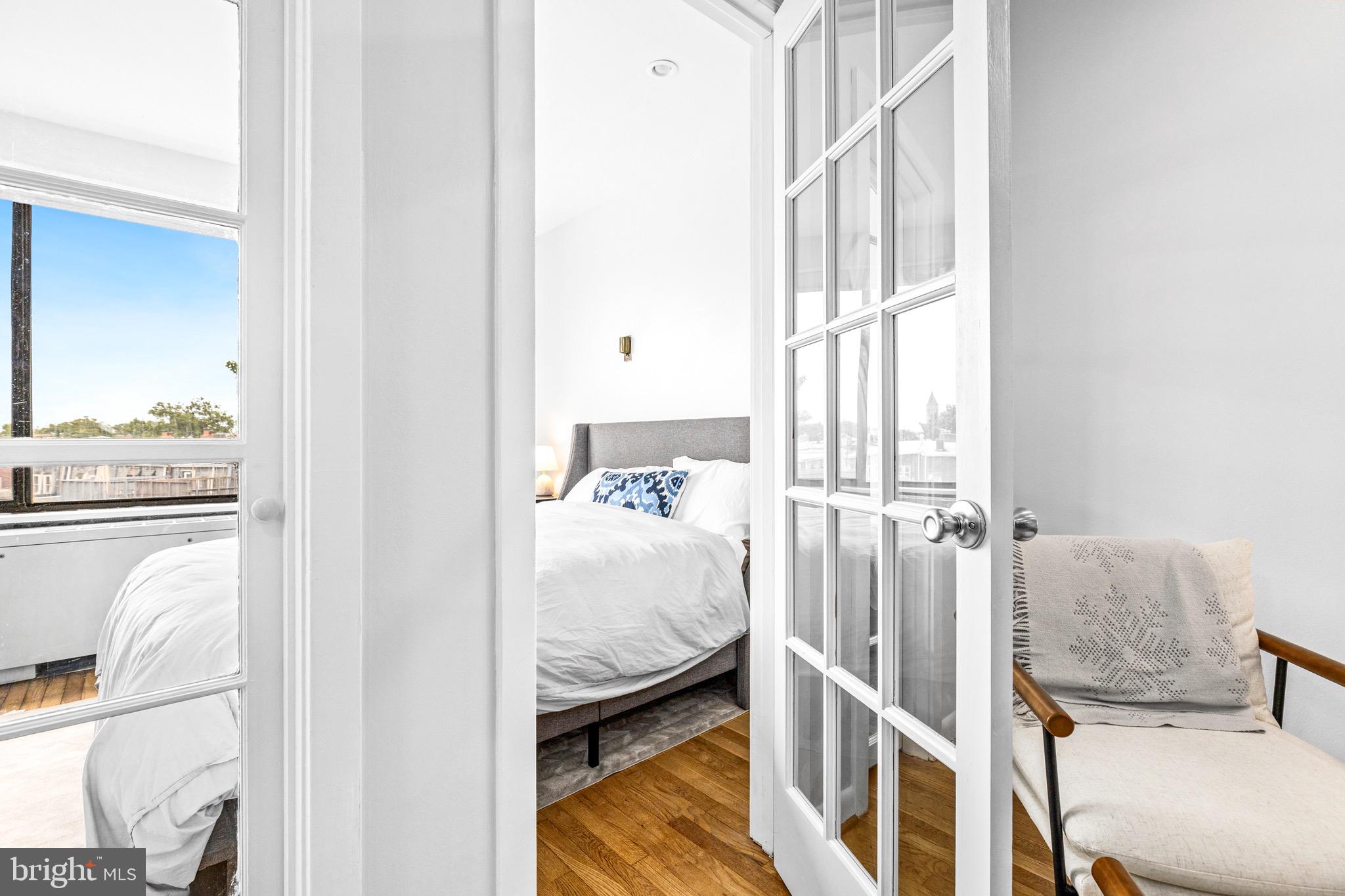 305 C Street Northeast, Unit 410 Washington, DC 20002 - Photo 10 of 15 a bedroom with a bed and a window