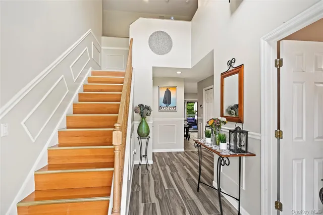a bathroom with a sink mirror vanity and toilet