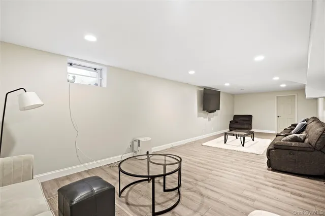 a view of a livingroom with furniture and wooden floor