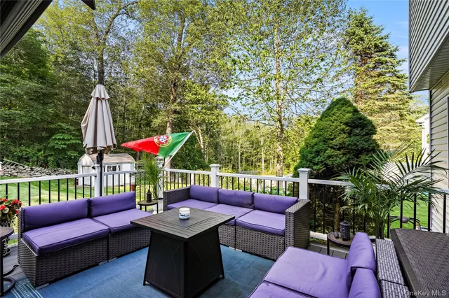 a view of a house with a backyard and a garden