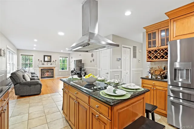 a kitchen with a table chairs stove and cabinets