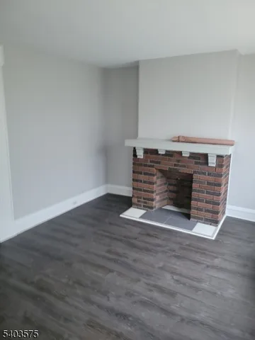 an empty room with wooden floor